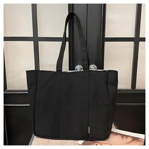 Black canvas tote bag for women, large capacity shoulder handbag for daily college use.