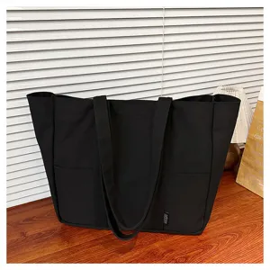 Black canvas tote bag, large capacity shoulder bag for daily casual use, student class bag style.