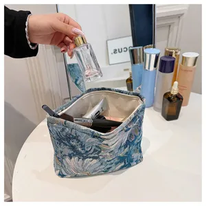 Chinese style vintage brocade cosmetic bag, elegant blue floral makeup pouch for daily storage.