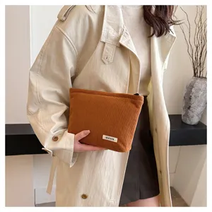 Brown corduroy makeup bag for women, stylish clutch pouch and daily portable storage bag.