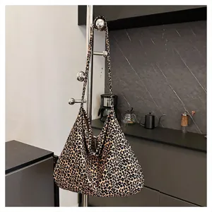 Leopard print slouchy shoulder bag detail view, casual aesthetic daily fashion handbag.