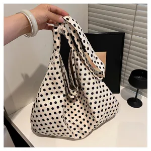 Canvas polka dot tote bag detail view showcasing unique lazy style and soft fabric texture.