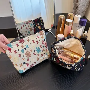 Linen jacquard cosmetic bag with floral pattern, portable makeup pouch and toiletry organizer.