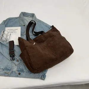 Casual corduroy shoulder bag with large capacity, perfect for daily commuting and retro style.