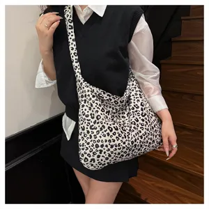 Detailed view of the casual leopard print canvas shoulder bag showcasing daily outfit styling.