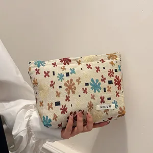 Linen jacquard cosmetic bag travel storage pouch with cute floral patterns for daily use.