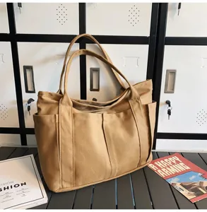 Large capacity khaki canvas tote bag with multiple pockets, casual shoulder bag for daily use.