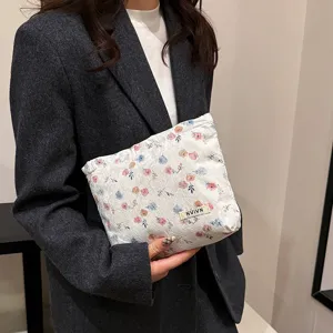 Floral lace cosmetic pouch detail view, portable makeup organizer bag for daily use.