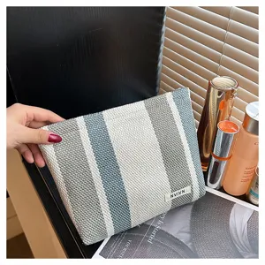 Striped woven cosmetic bag with zipper, portable travel storage pouch and daily makeup organizer.