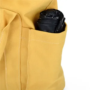 Yellow canvas tote bag for women, casual shoulder handbag with side pocket detail, durable daily.