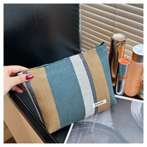 Striped woven cosmetic bag detail, large capacity portable travel makeup clutch bag for women.
