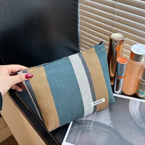 Large capacity striped cosmetic bag, portable linen makeup pouch for travel and daily use.