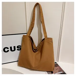 Casual canvas tote bag for women, stylish shoulder handbag with large capacity and dual straps.