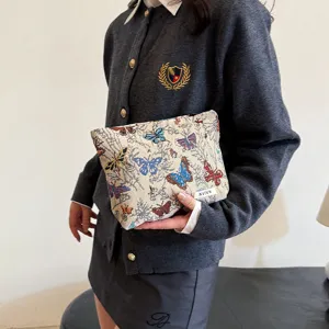 Large capacity butterfly pattern makeup bag linen zipper storage pouch for women daily use.
