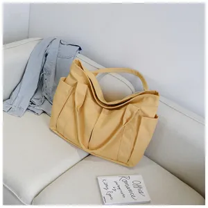 Canvas tote bag detail view, multi-pocket design, daily casual style and spacious capacity.