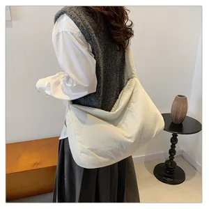 Detailed view of women casual white puffer crossbody bag, soft tote style for daily commuting.