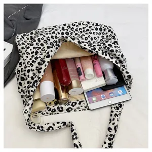 Detail view of the fashion leopard print canvas tote bag, showcasing large capacity storage space.