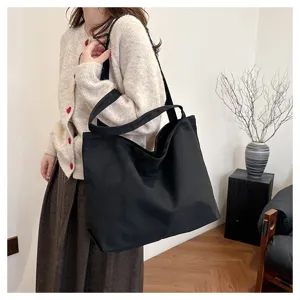 Korean style black canvas tote bag for women large capacity shoulder shopping handbag daily use.
