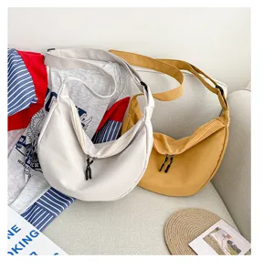 Sac bandoulière en toile décontracté, grand sac croissant pour femme, sac fourre-tout élégant.