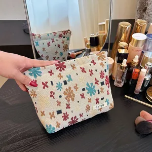 Retro linen jacquard floral cosmetic bag for travel and daily makeup storage pouch.