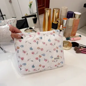 White floral lace cosmetic bag, portable zip makeup pouch, elegant vintage storage bag.