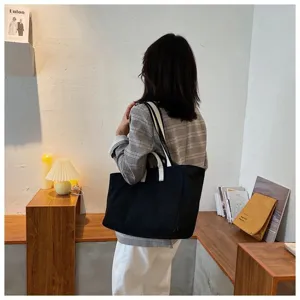 Canvas tote bag for women, large capacity shoulder bag, casual commuting style daily handbag.