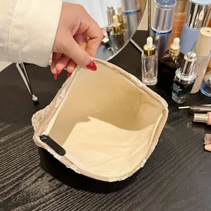 Beige lace cosmetic bag with large capacity, portable makeup pouch and stylish storage organizer.