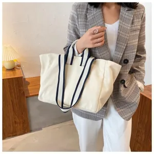 Canvas tote bag lifestyle detail view, casual daily commuting style, elegant design.
