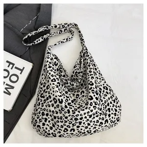 Leopard print canvas shoulder bag detail, casual slouchy tote handbag, daily fashion accessories.