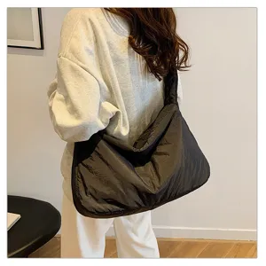 Detailed view of the casual black padded shoulder bag, large capacity fashion tote design.