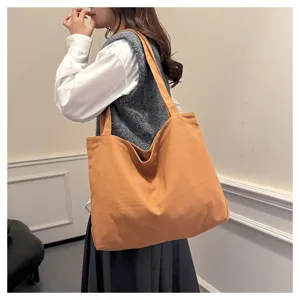 Korean style casual canvas tote bag for women, large capacity orange shoulder shopping bag.