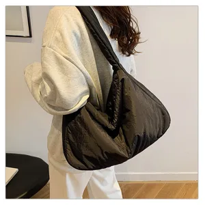 Detailed view of women black puffer shoulder bag, large capacity casual hobo tote cross body.