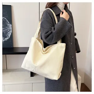 Korean style minimalist white canvas tote bag for women, large capacity shoulder shopping bag.