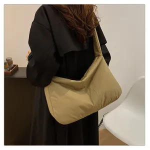 Detail view of casual padded shoulder bag, large capacity design for daily commute use.