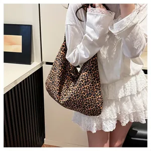 Detailed shot of the stylish leopard print canvas shoulder tote bag, slouchy and casual style.