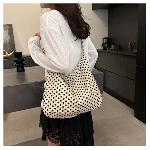 Chic polka dot canvas shoulder bag for women, casual slouchy large capacity hobo tote.