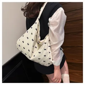 Korean style canvas shoulder bag for women, large capacity lazy style tote with bow print.