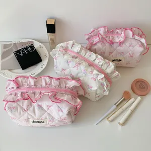 Ins Korean style quilted makeup bag with cute ruffles and bow prints, portable cosmetic pouch.