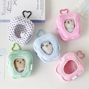 Cute polka dot plush mini doll bag with heart keychain and clear window for cotton dolls.