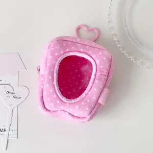 Close-up detail of the pink polka dot plush mini doll bag with heart window and cute keychain.
