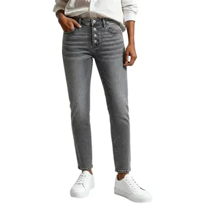 High waisted button fly grey denim jeans detail showing washed texture and slim fit design