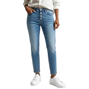High-waisted button fly stretch denim jeans detail view, featuring classic retro wash and slim fit.