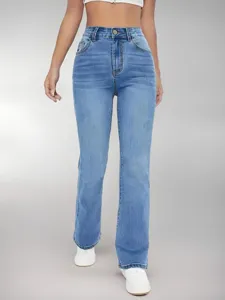 High-waisted light blue flared jeans for women, slim fit long denim trousers for stylish look.