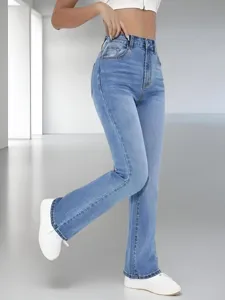 Detailed shot of high-waisted light blue flare jeans, showcasing slim fit and denim texture.