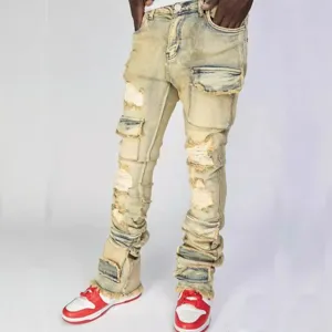 Men's distressed stacked denim cargo jeans featuring multi-pockets and a stylish flared hem.