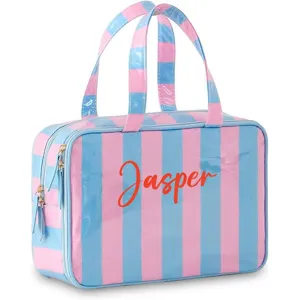 Close-up detail of pink and blue striped waterproof PVC cosmetic travel storage bag with handle.