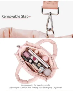 Pink quilted puffer crossbody tote bag detail showing removable strap and large capacity interior.