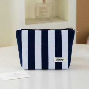 Blue white striped cosmetic pouch, stylish minimalist makeup bag for daily use.