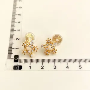 Gold plated cubic zirconia flower clip-on earrings with size ruler display for women