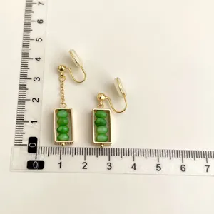 Gold-tone clip-on earrings featuring green bead abacus design with detail measurement ruler view.